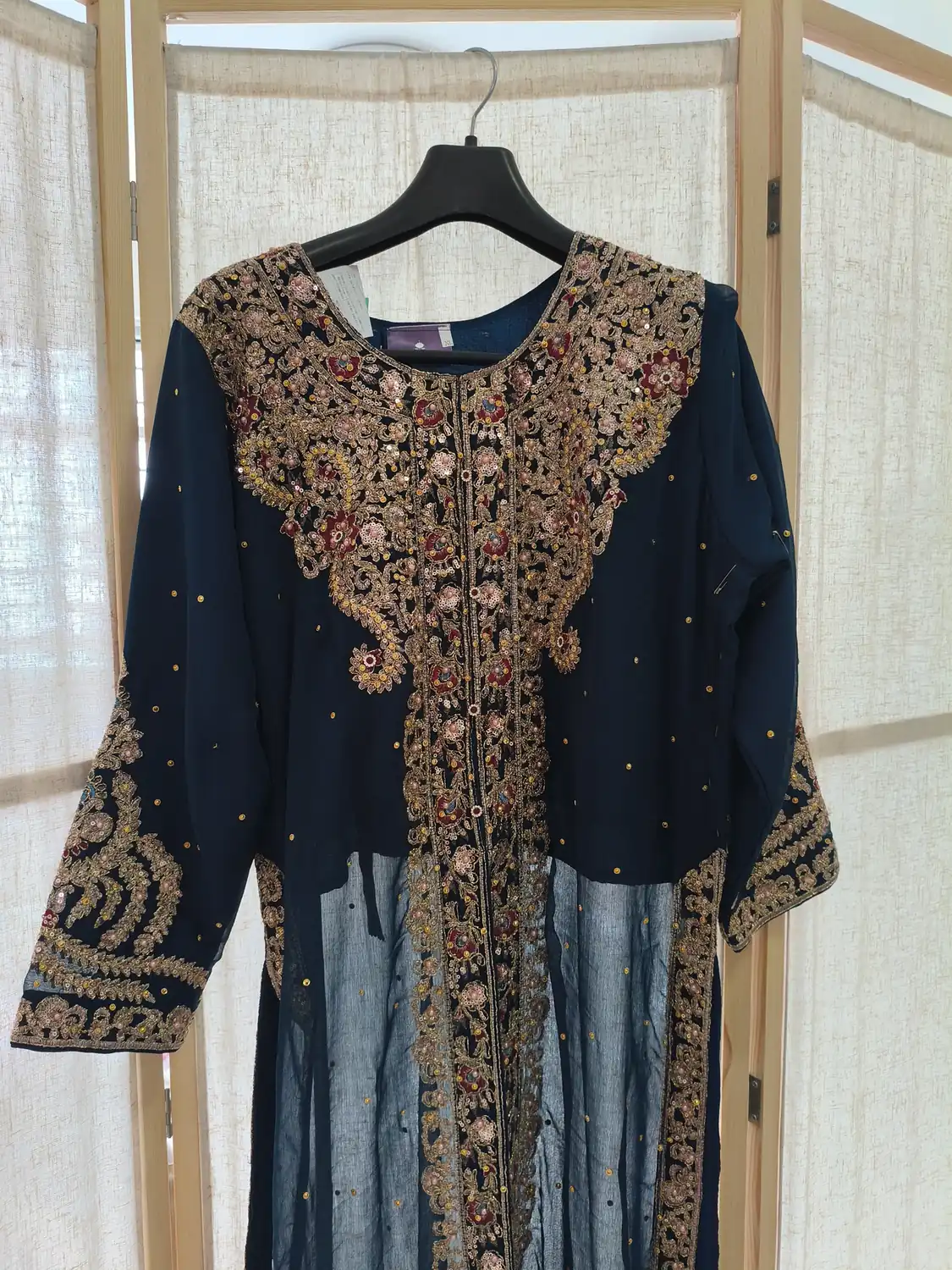 Navy traditional dress with gold and red hand embroidery on the bodice
