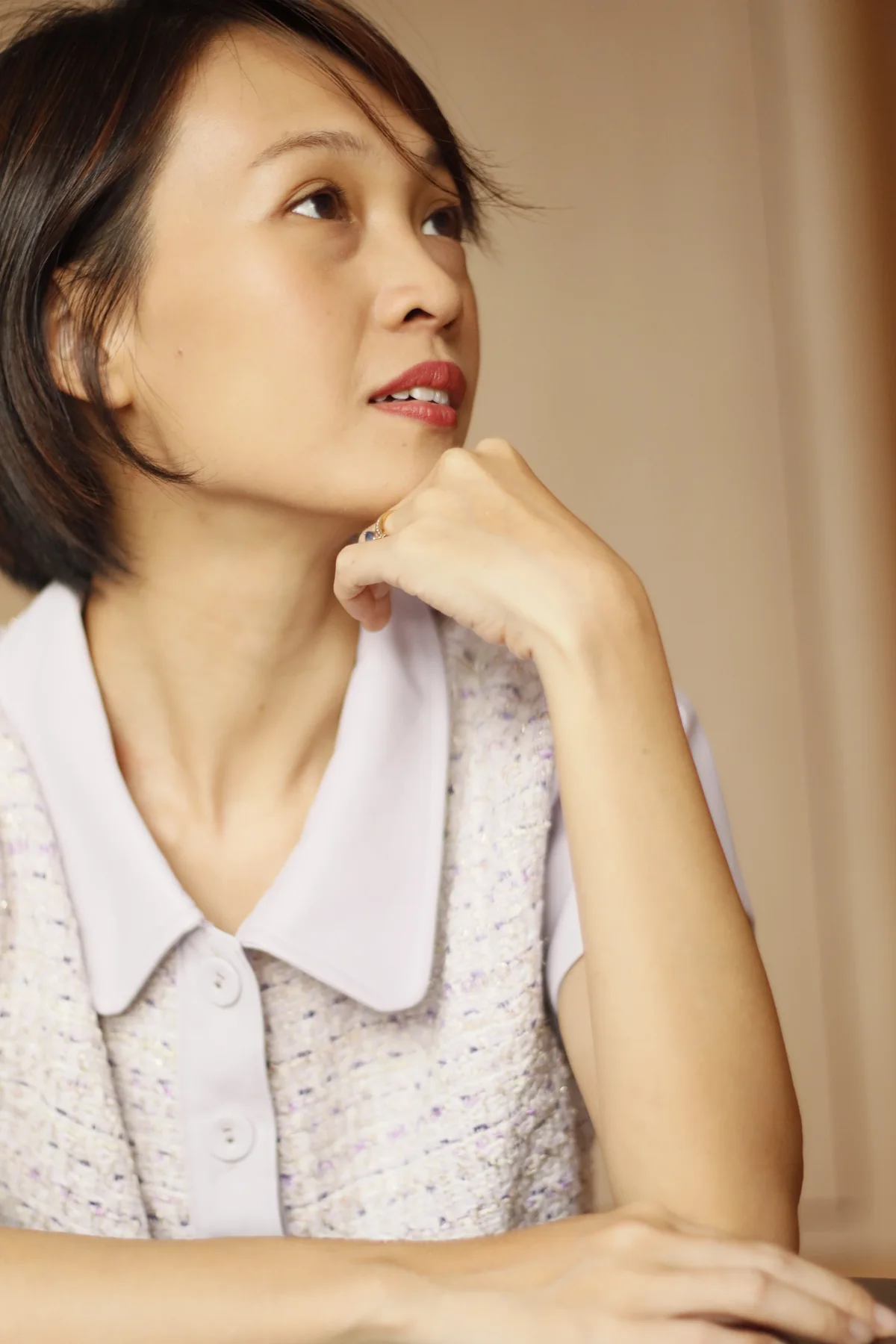 Client checking the fit of a tailored dress after alterations