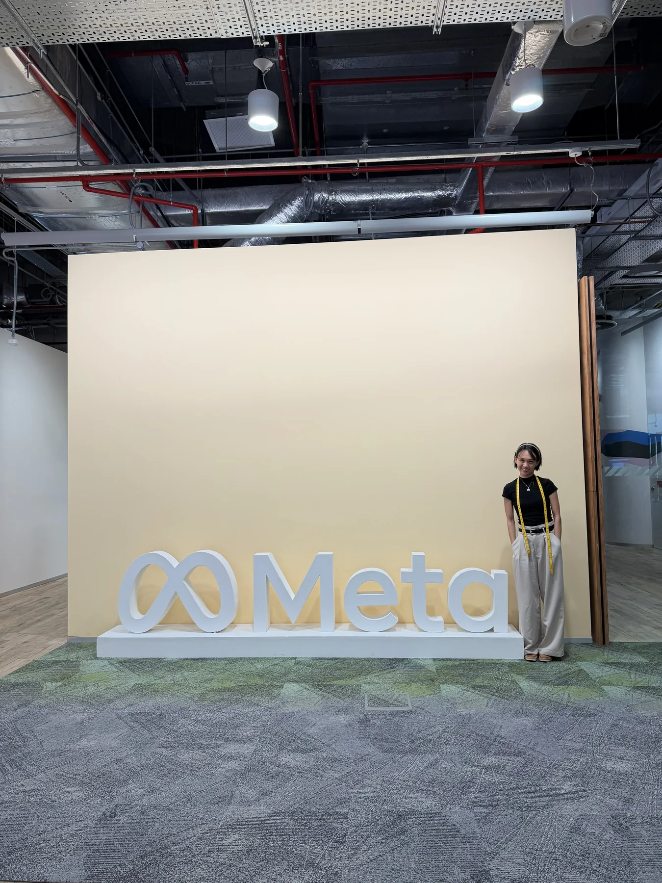 Client measurement session for garment alterations at a corporate office pop-up