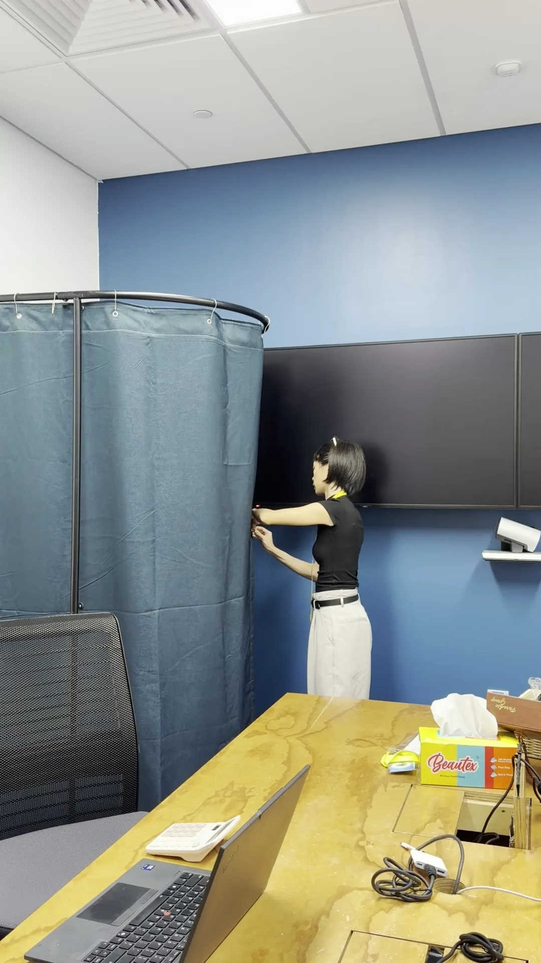 Fitting booth with privacy screen set up in a meeting room during an office pop-up