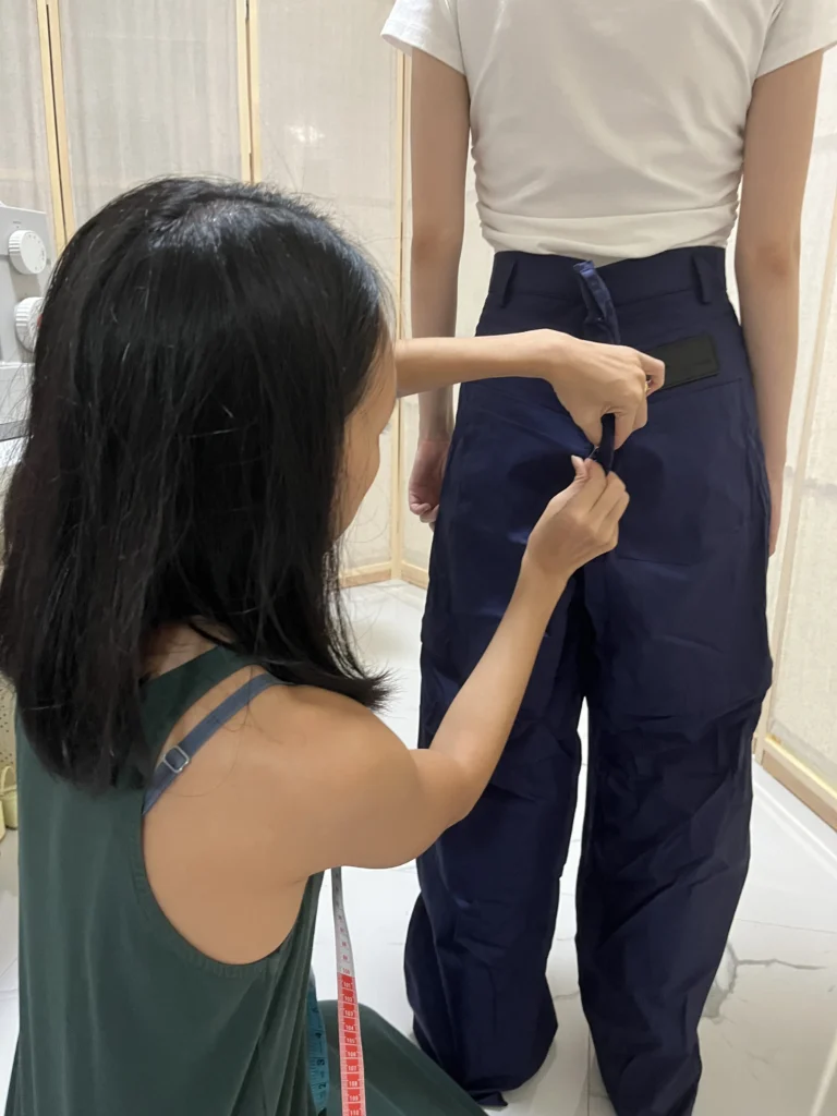 Stitch and Steam seamstress doing precise fitting